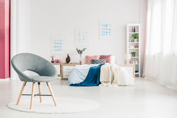 istock Cozy bedroom with grey chair 947849182