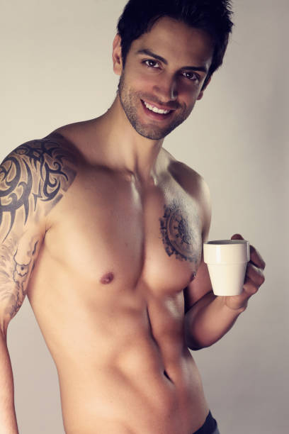 istock Sexy macho shirtless with mug. 947850286