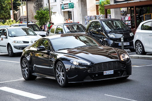 La Condamine, Monaco - August 2, 2014: Black sports car Aston Martin Vantage in the city street.