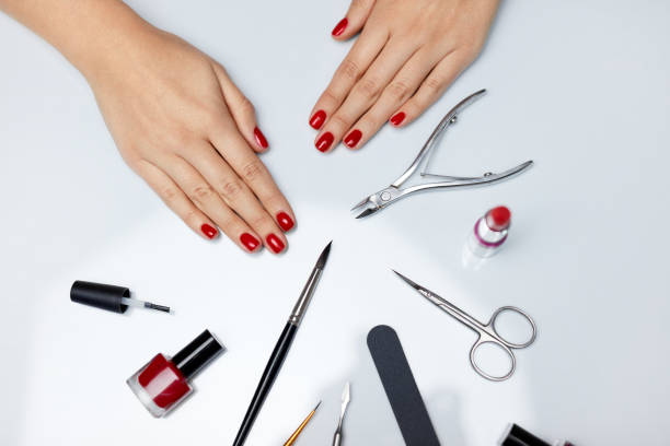 istock Hands Care. Beautiful Female Hands With Red Polish And Tools 947853918