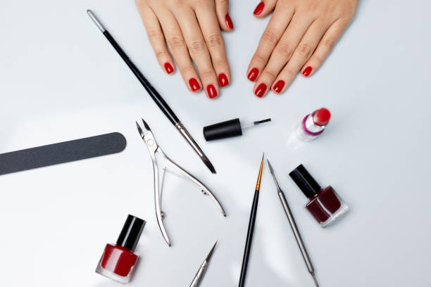 istock Hands Care. Beautiful Female Hands With Red Polish And Tools 947854008