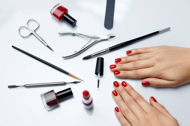 istock Hands Care. Beautiful Female Hands With Red Polish And Tools 947854034
