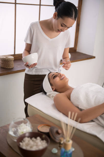 istock Pleasant skillful beautician preparing a facial mask 947857294
