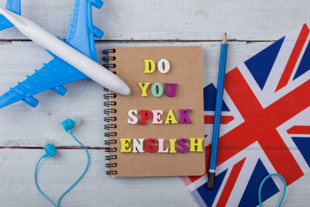 Concept of learning English language - colorful letters with text "Do you speak English", flag of the UK, airplane, headphones Concept of learning English language - colorful letters with text "Do you speak English", flag of the UK, airplane, headphones on white wooden background english spoken stock pictures, royalty-free photos & images