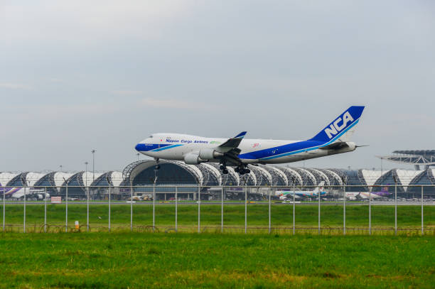 Nippon Cargo Airlines Plane landing to runways at suvarnabhumi international airport in Bangkok ,Thailand. Bangkok, Thailand - July 30, 2017: Nippon Cargo Airlines Plane landing to runways at suvarnabhumi international airport in Bangkok ,Thailand. This airport is one of the most populated airports in the world. nippon cargo airlines photos stock pictures, royalty-free photos & images