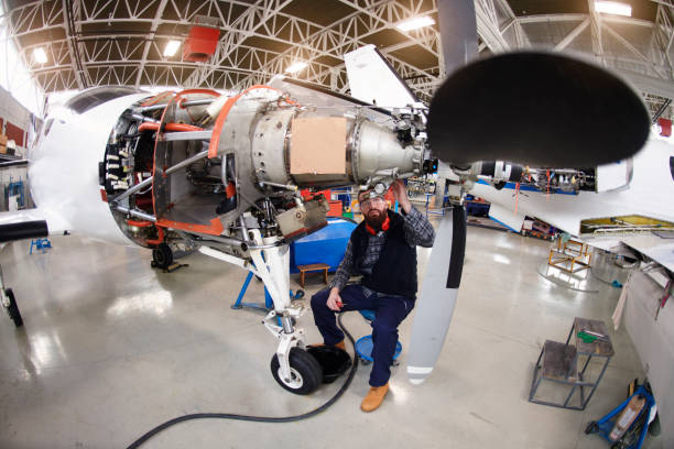 istock Aircraft mechanic in the hangar 947874420