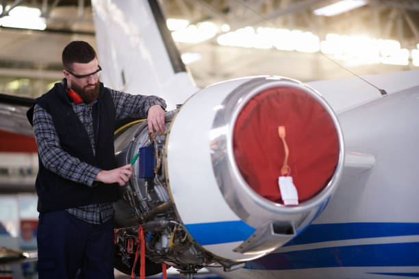 istock Aircraft mechanic in the hangar 947874954
