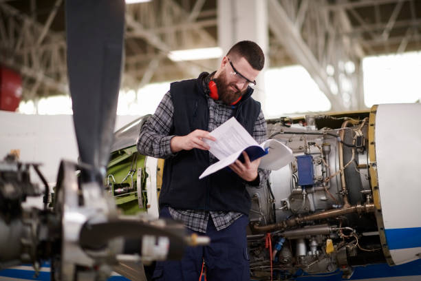 istock Aircraft mechanic in the hangar 947874956
