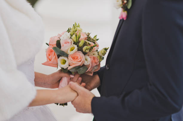 istock The newlyweds hold hands for a bouquet on both sides 723. 947879912