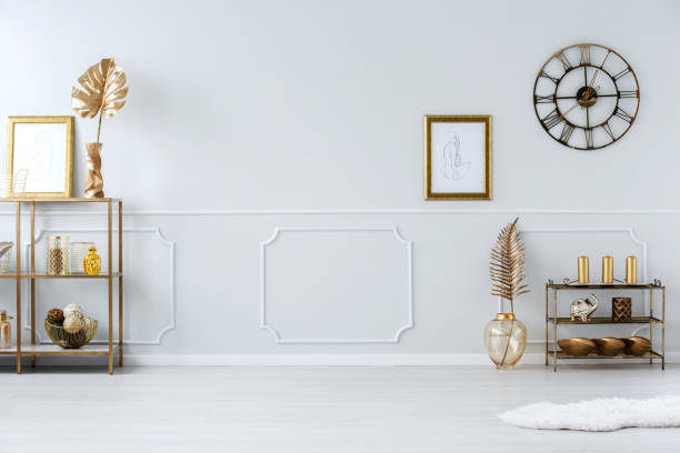 istock Sophisticated gold living room interior 947880734