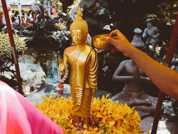 istock Buddha bathing ceremony during Songkran in Thailand 947893352