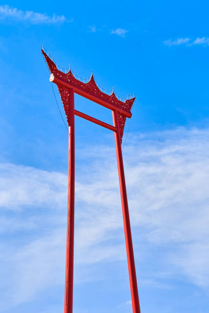 istock Giant red swing on blue sky in Bangkok, Thailand 947894200