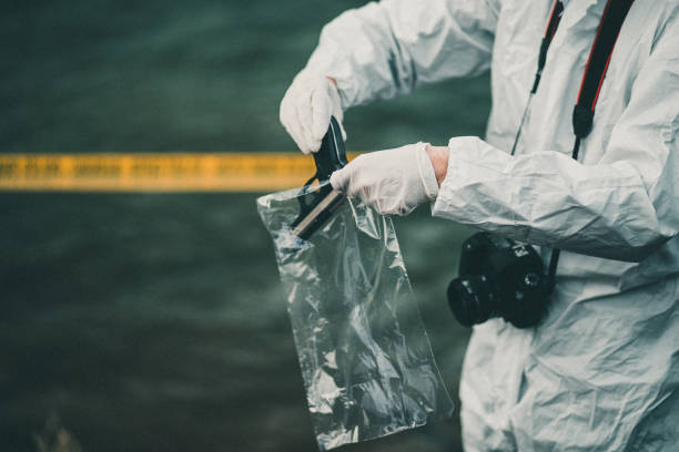 istock Forensic investigator collecting evidence 947895856