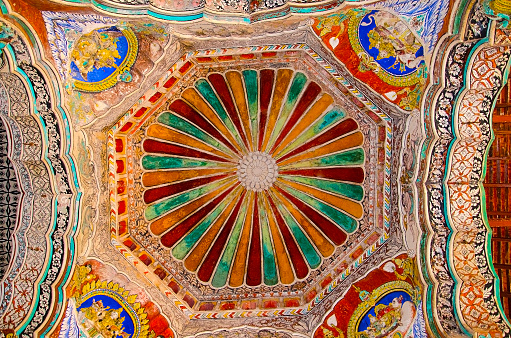 Colorful paintings on ceiling wall of Darbar Hall of the Thanjavur Maratha palace, Thanjavur, Tamil Nadu, India. Known locally as  residence of the Bhonsle family which ruled over the Tanjore region from 1674 to 1855. After the fall of the Thanjavur Nayak kingdom, it was the official residence of the Thanjavur Marathas