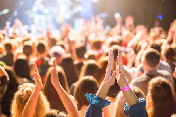istock Audience applauded by the stage artist. 947903124