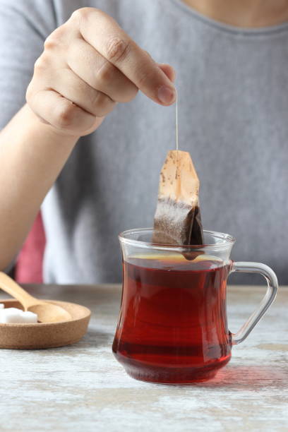 istock Dipping tea bag into a glass 947903314