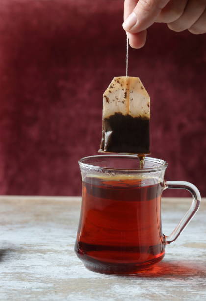 istock Dipping tea bag into a glass 947903322