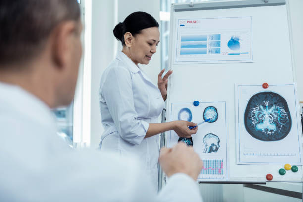 istock Experienced female neurologist presenting her research 947905510