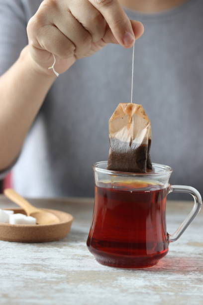 istock Dipping tea bag into a glass 947905618
