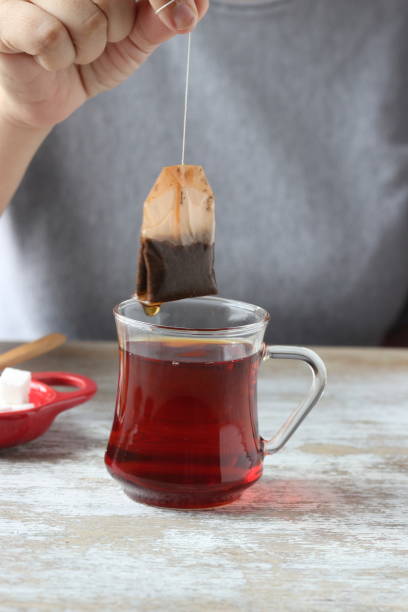 istock Dipping tea bag into a glass 947906984