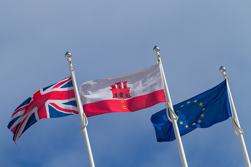 Three flags at the Spanish - Gibraltar frontier: the United Kingdom, Gibraltar and Europe.