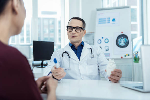 istock Professional doctor talking to her patient 947913094