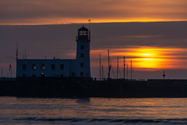 istock Sunrise at Scarborough Lighthouse, North Yorkshire, UK 947913530