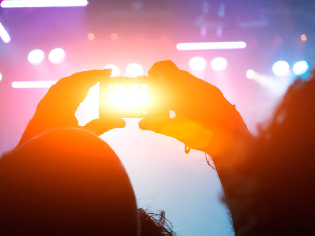 istock Smart phone filming a live concert scene 947919020