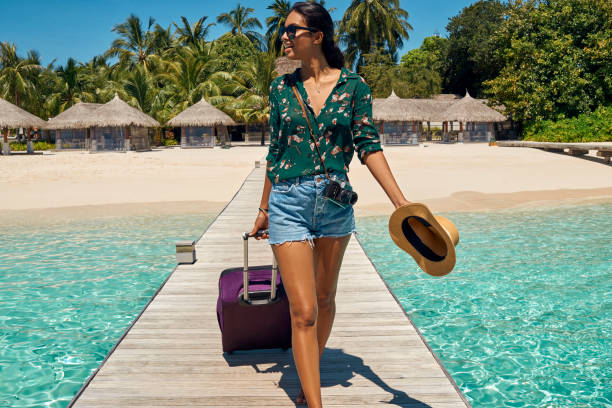istock beautiful young woman traveler 947920320