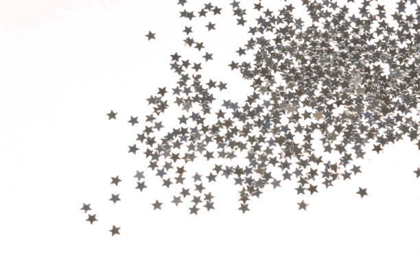 istock Glittering silver stars on white background 947924674