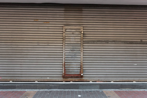 istock sidewalk by street wall & door 947925660