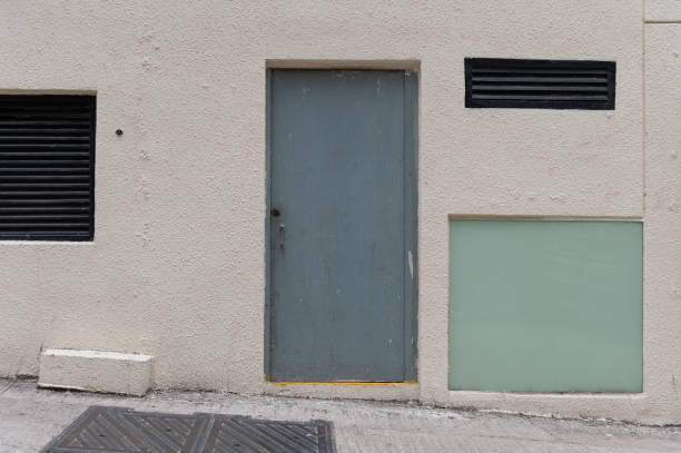 istock sidewalk by street wall & door 947930904