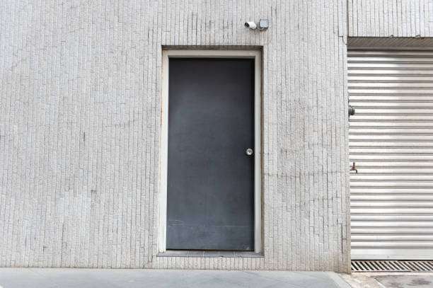 istock sidewalk by street wall & door 947932688