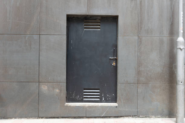 istock sidewalk by street wall & door 947937274
