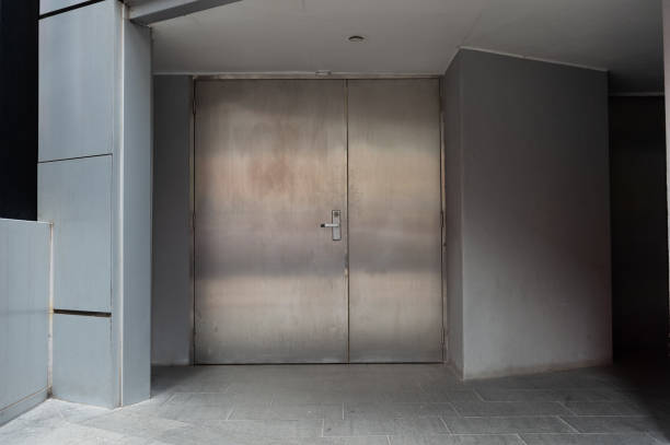 istock sidewalk by street wall & door 947937472