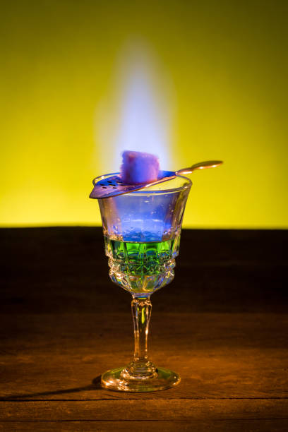 Burning Sugar On Spoon In Glass Of Absinthe Stock - Download Image Now - Absinthe, Alcohol - Drink, Bar - Establishment - iStock