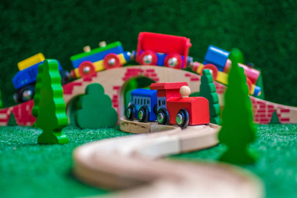 istock Wooden train with trees and bridge 947951512