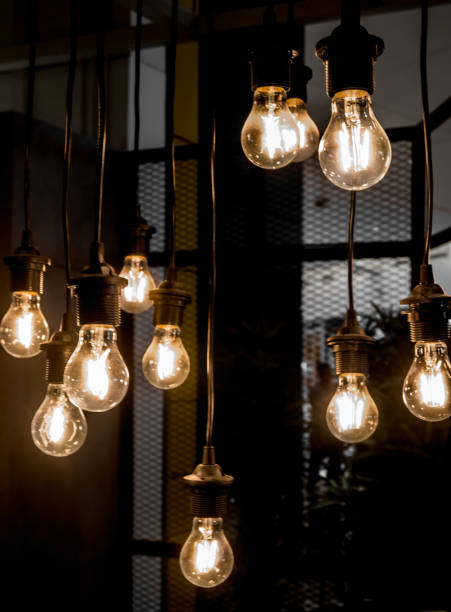 istock A glowing old light bulbs on the dark background 947951938