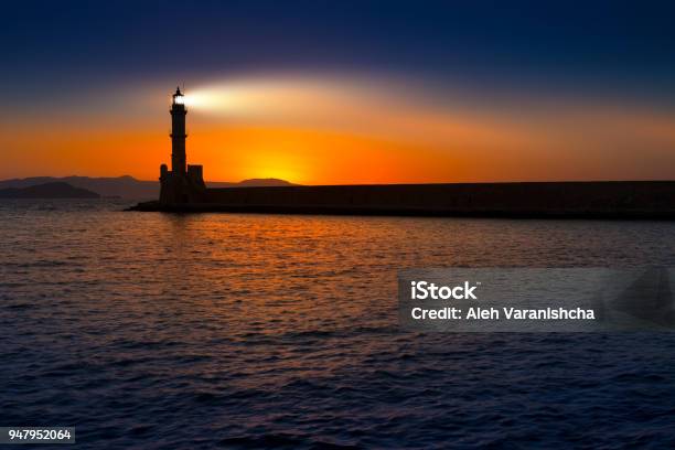 A Beautiful Night Sky Behind A Shining Lighthouse Crete Greece Stock Photo - Download Image Now