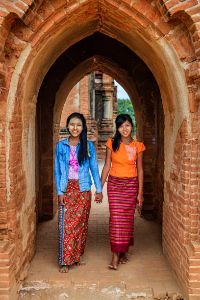 istock Young Burmese girls walking in Bagan, Myanmar 947956478