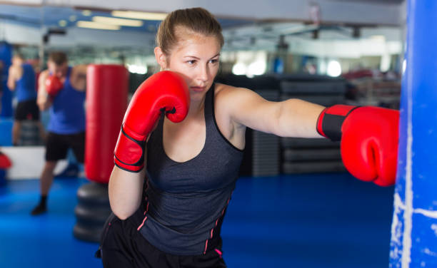 istock Woman boxing in gym 947956592
