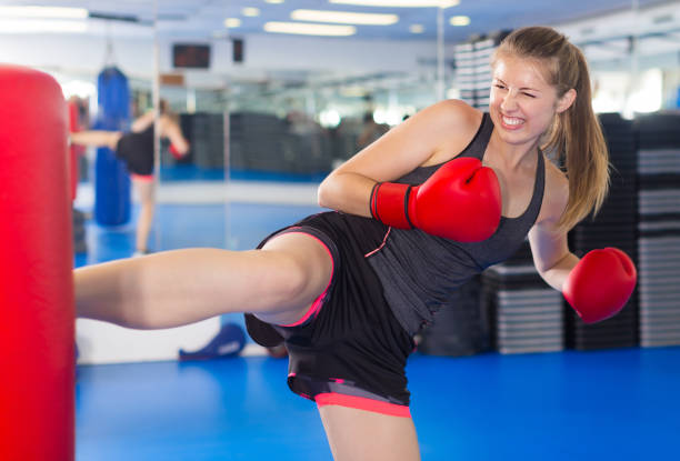 istock Cheerful female is doing foot-kick 947958940