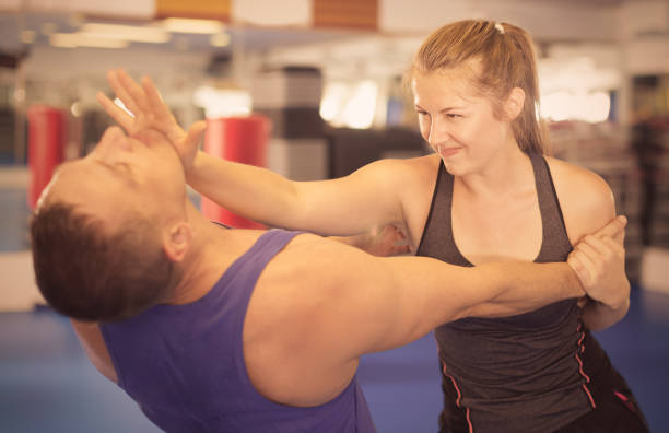 istock Young woman is fighting with trainer 947958948
