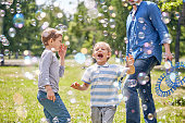 Funny Little Boy with Soap Bubbles