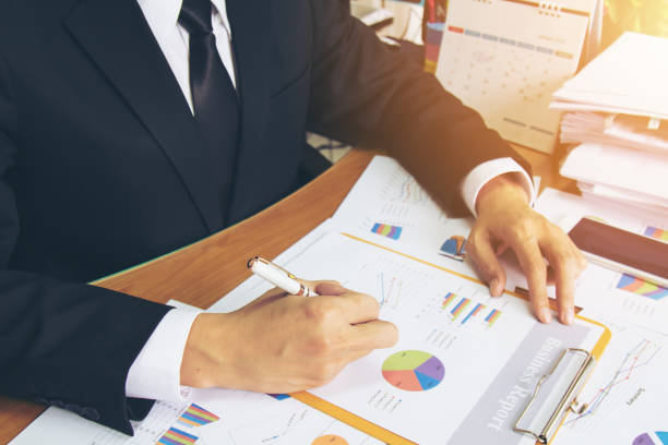 istock Businessman check business report. 947959642