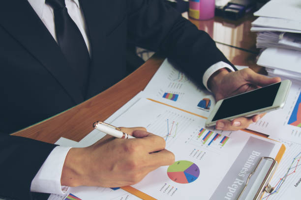 istock Businessman check business report. 947959660