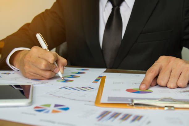 istock Businessman check business report. 947959672