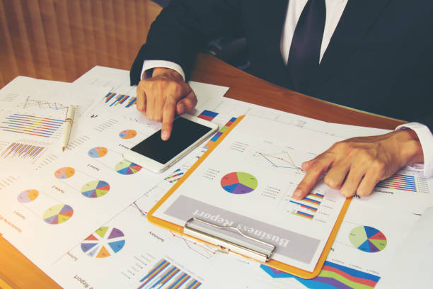 istock Businessman check business report. 947959690