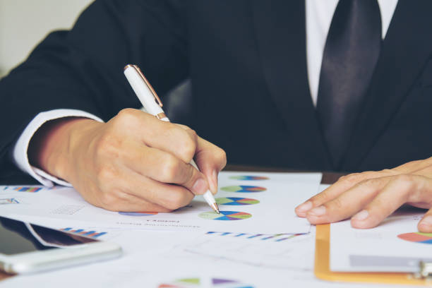 istock Businessman check business report. 947959722