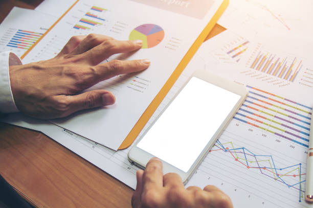 istock Businessman check business report. 947959898